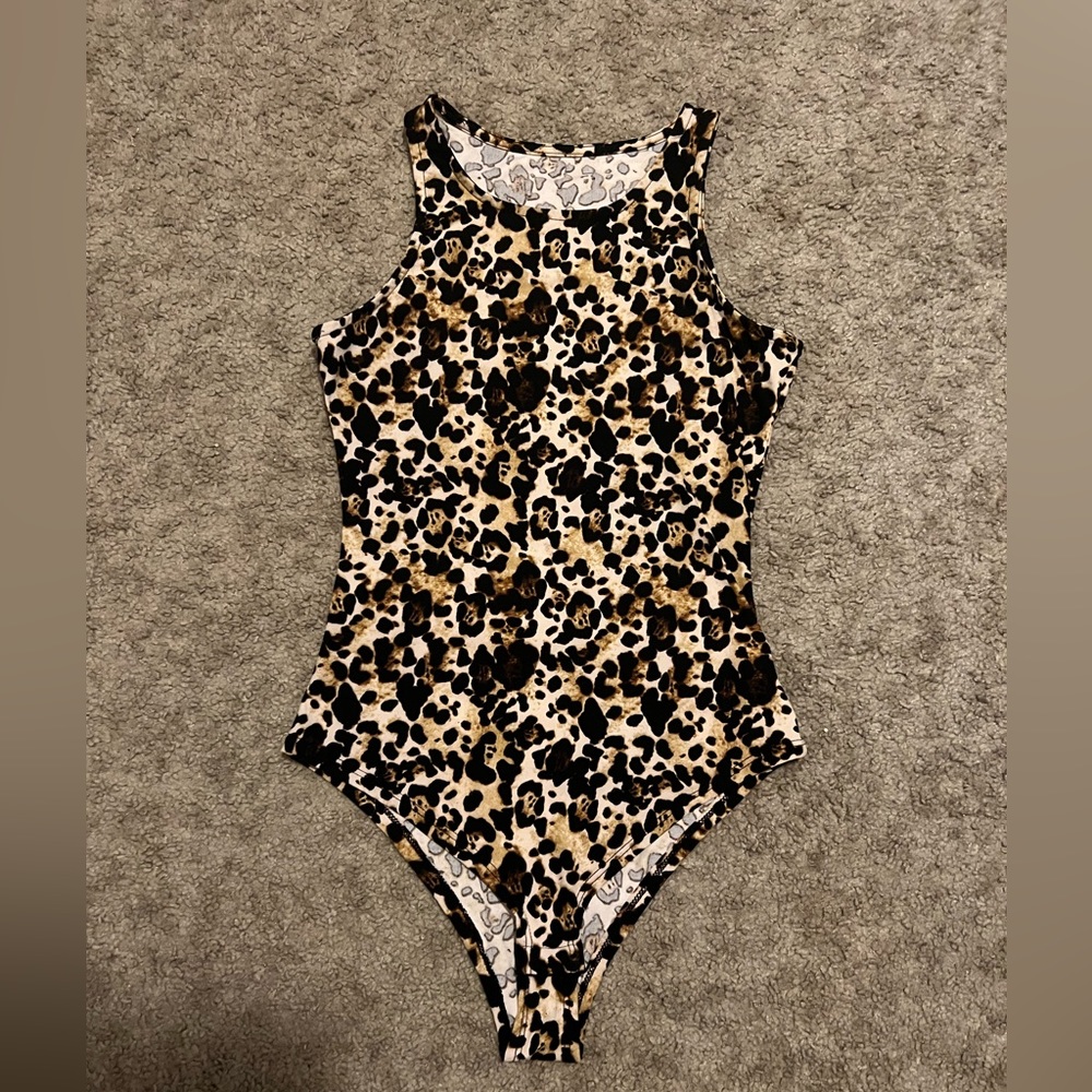 Leopard print body suit with snaps at the bottom